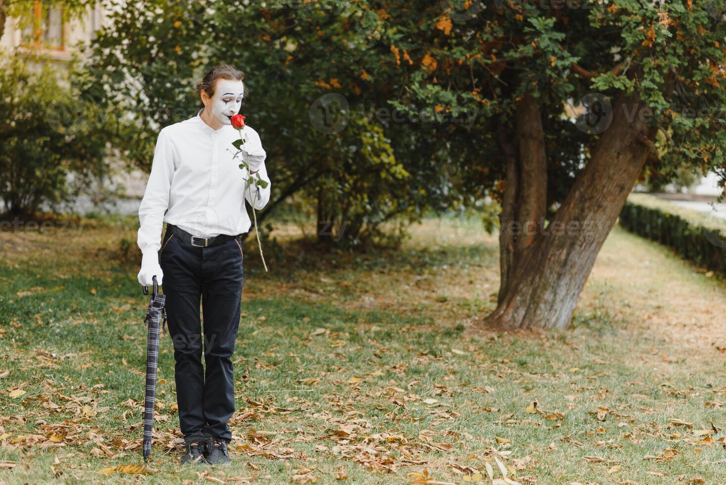 Portrait of a man, artist,clown, MIME. Shows something. Mime actor shows different emotions. photo