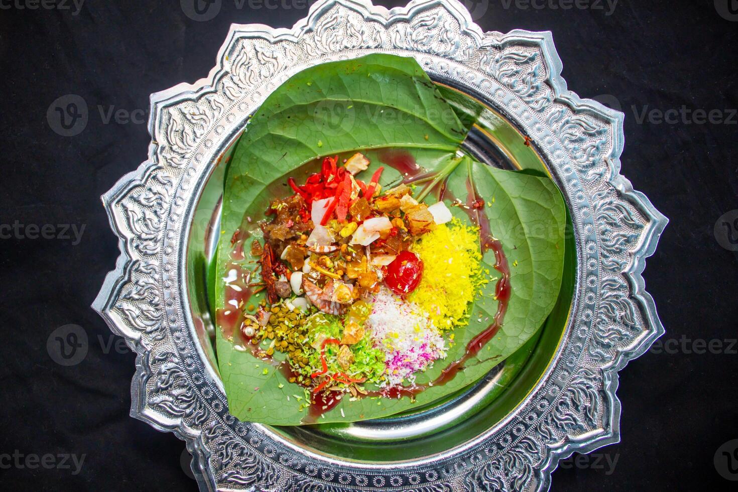 Bombay paan masla colorful decorated on betel leaf top view photo