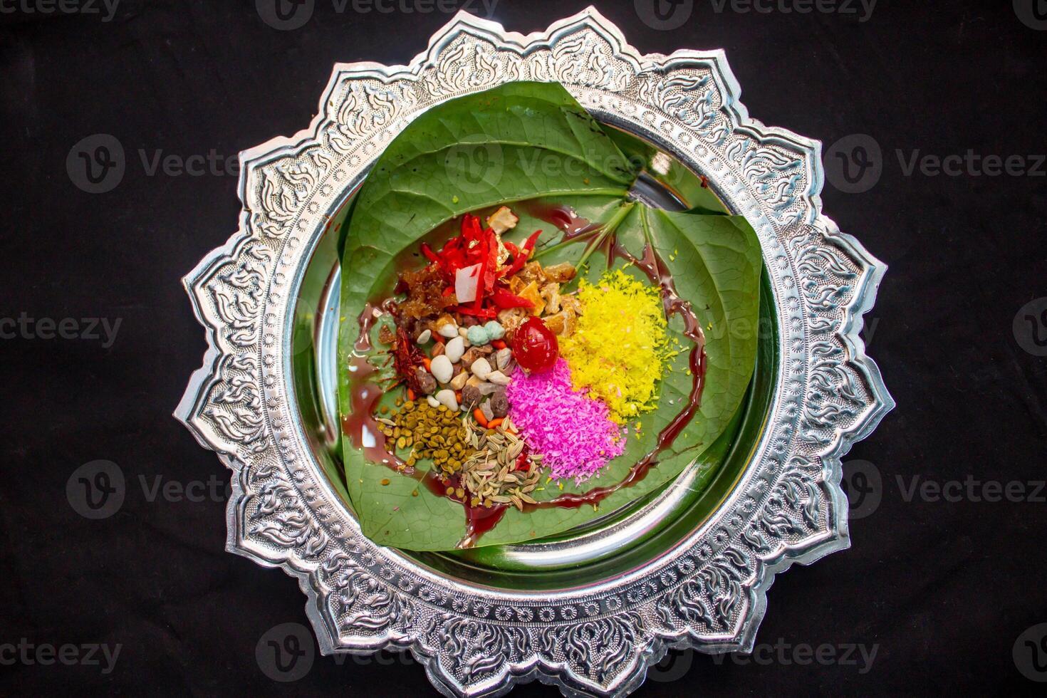 Dilkhush indian paan masala on betel leaf top view photo