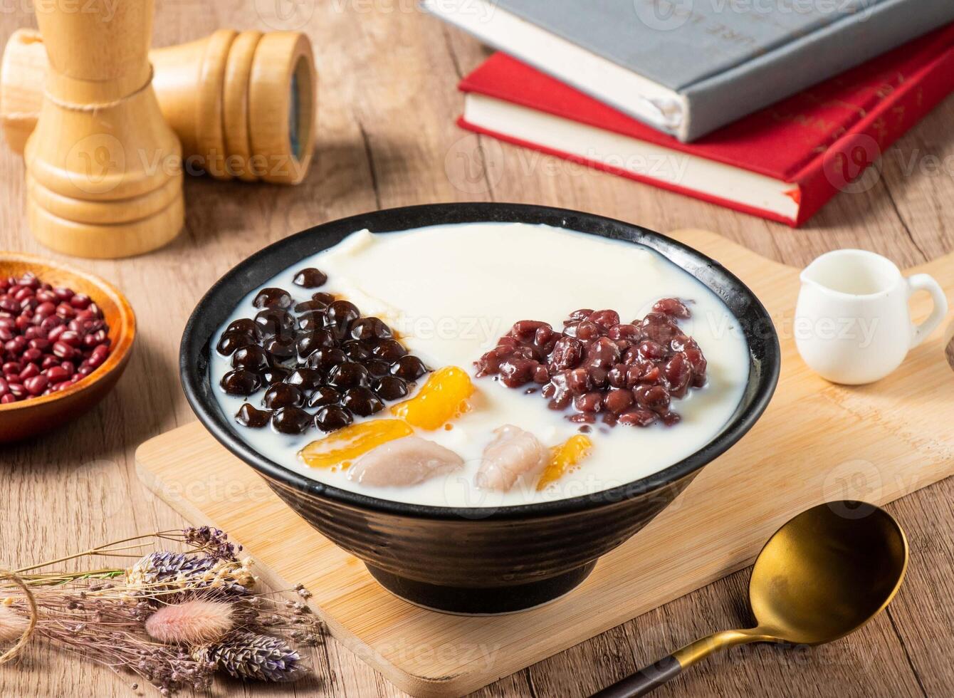 Taiwan sweet, tofu and beans and soy milk pudding served in bowl isolated on table top view of asian food photo