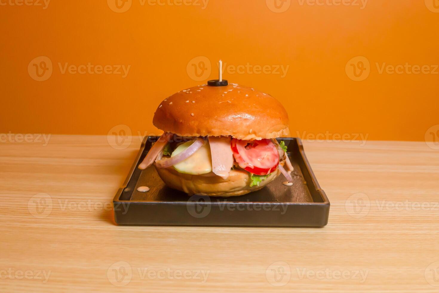 Encantos Burger served in dish isolated on table top view of fastfood photo