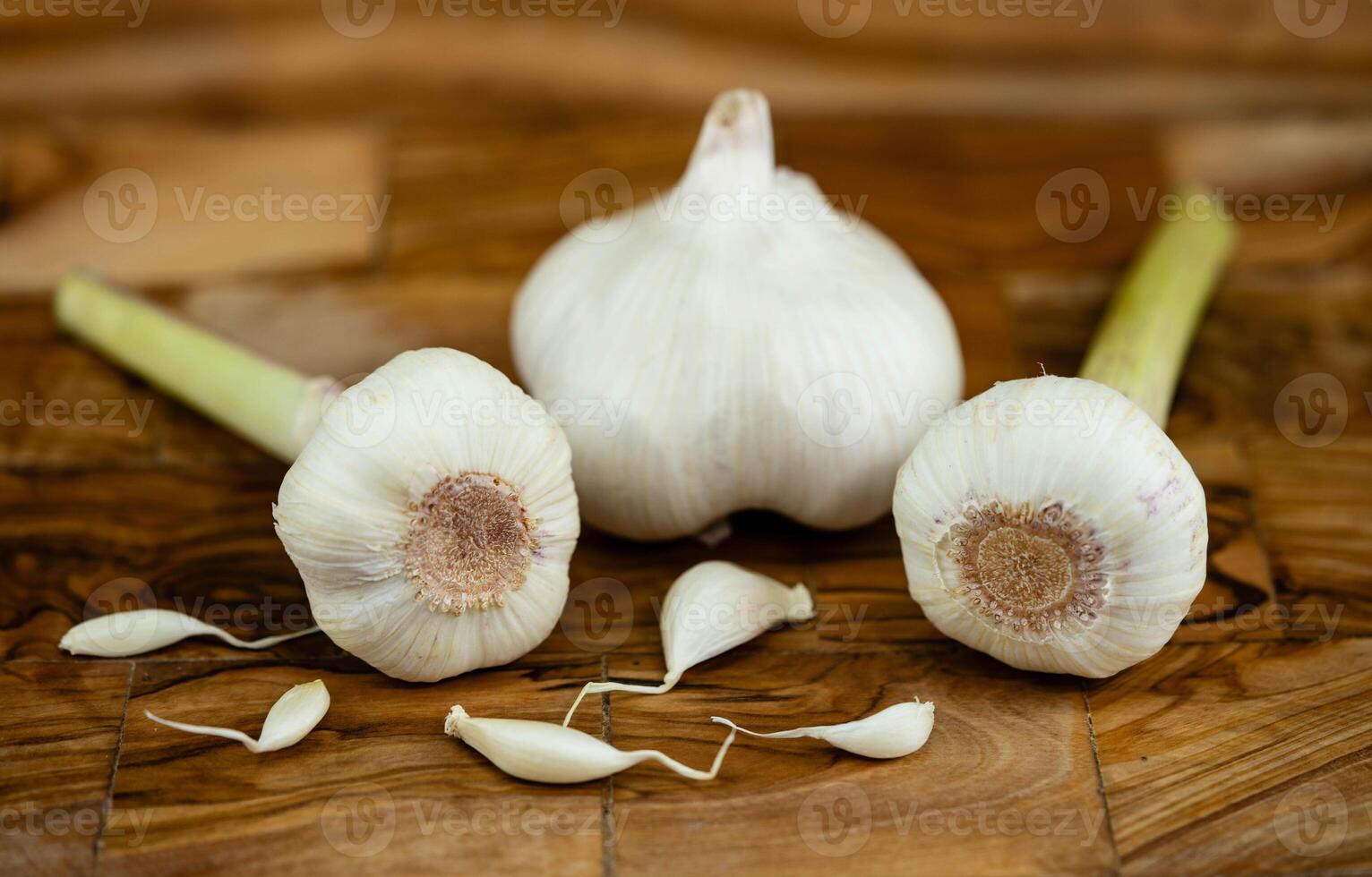 fresh Garlic for garlicoil on olive wood photo