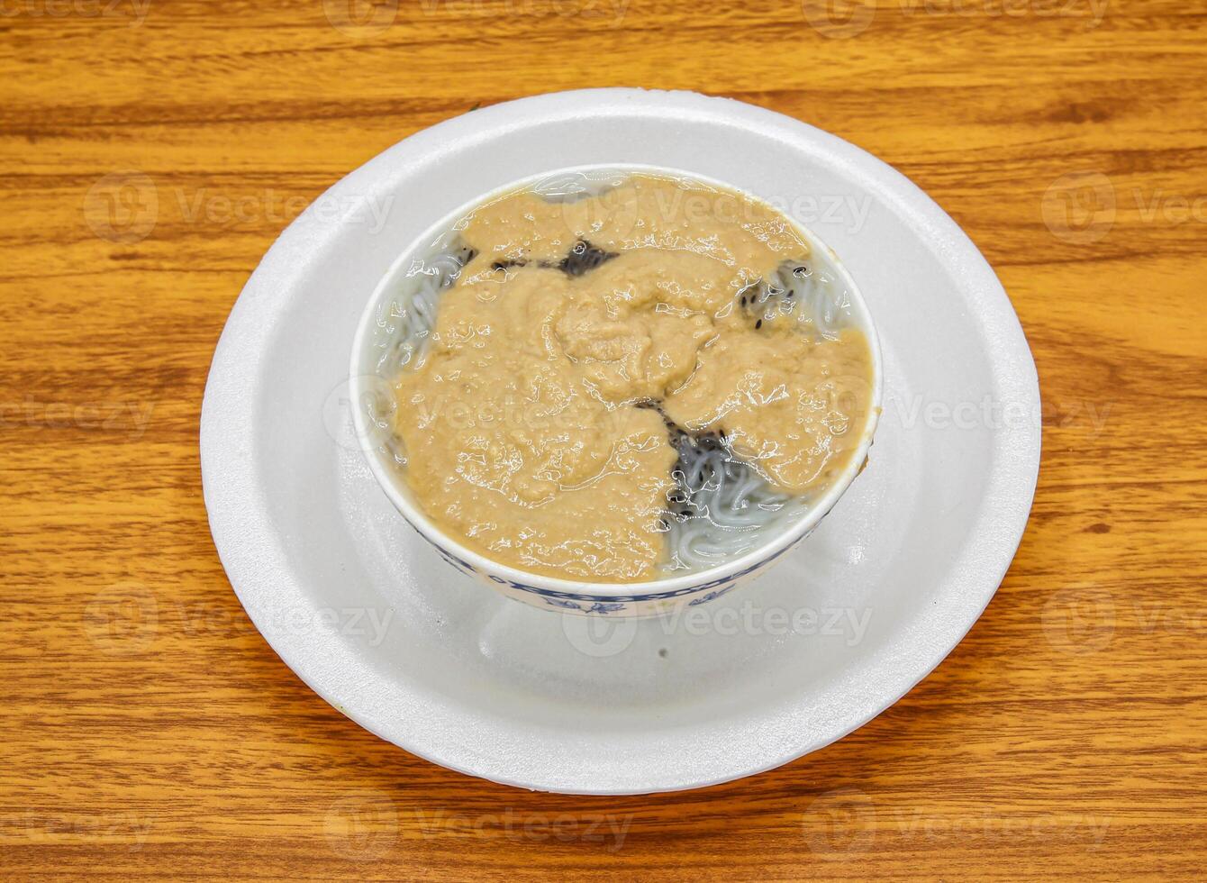 Kulfi falooda served in plate isolated on table top view of indian and pakistani sweet food photo