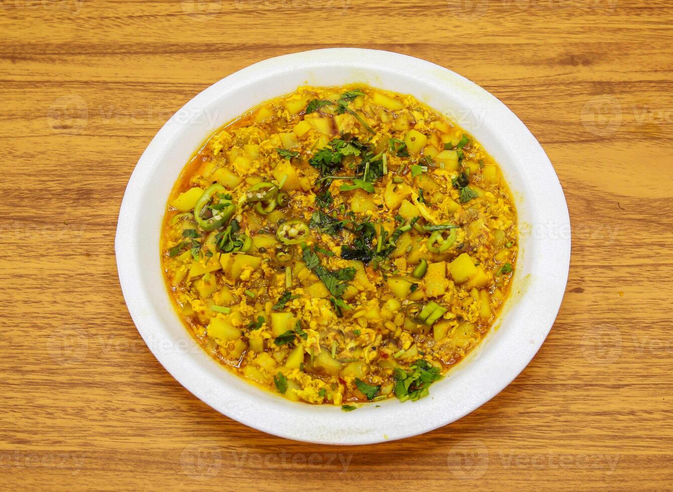 Aloo anday bhurji served in plate isolated on table top view of indian and pakistani spicy food photo