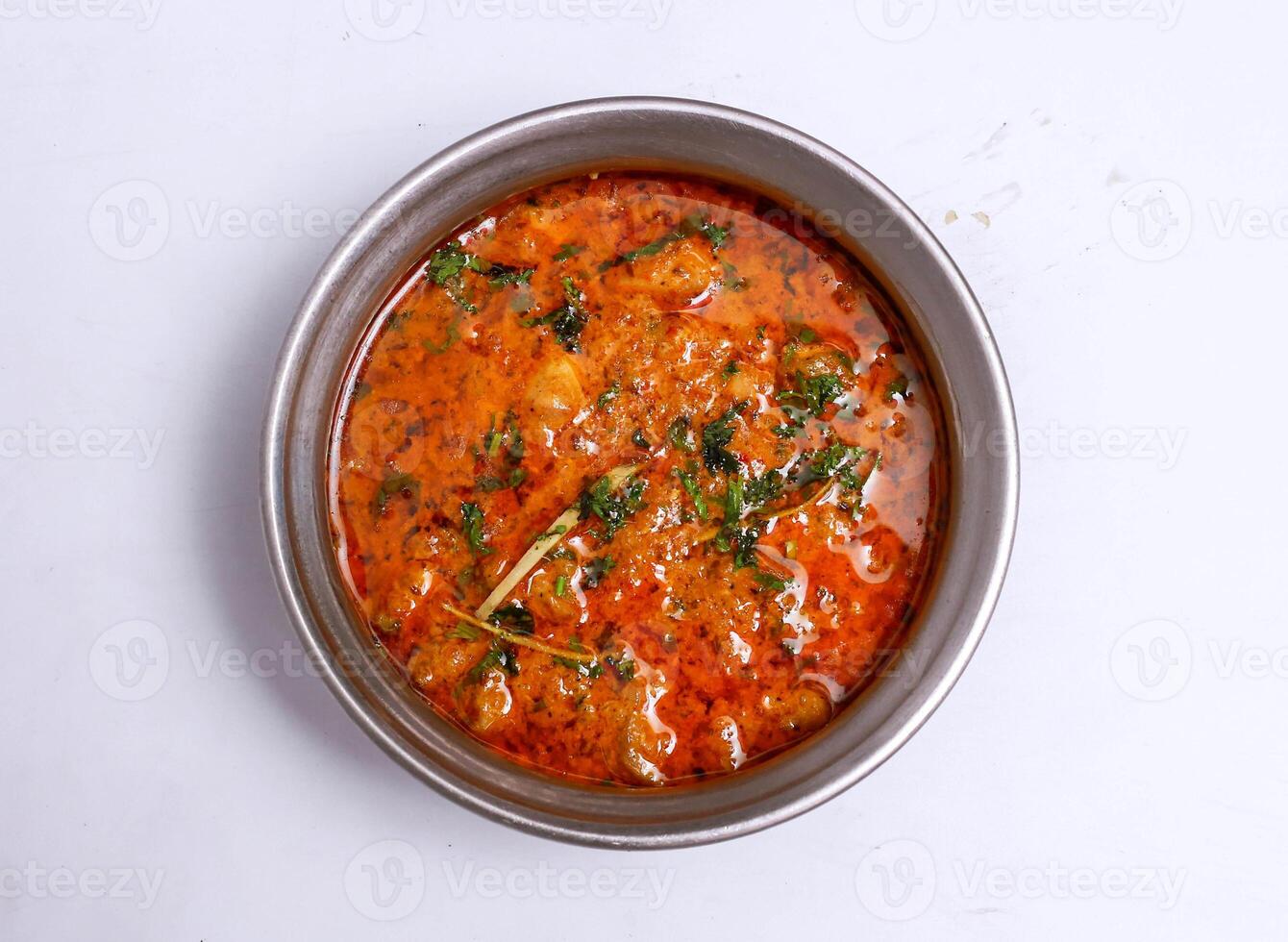 chicken achari handi served in dish isolated on grey background top view of pakistani food photo