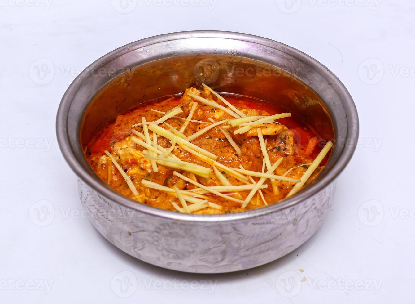 chicken ginger handi served in dish isolated on grey background top view of pakistani food photo