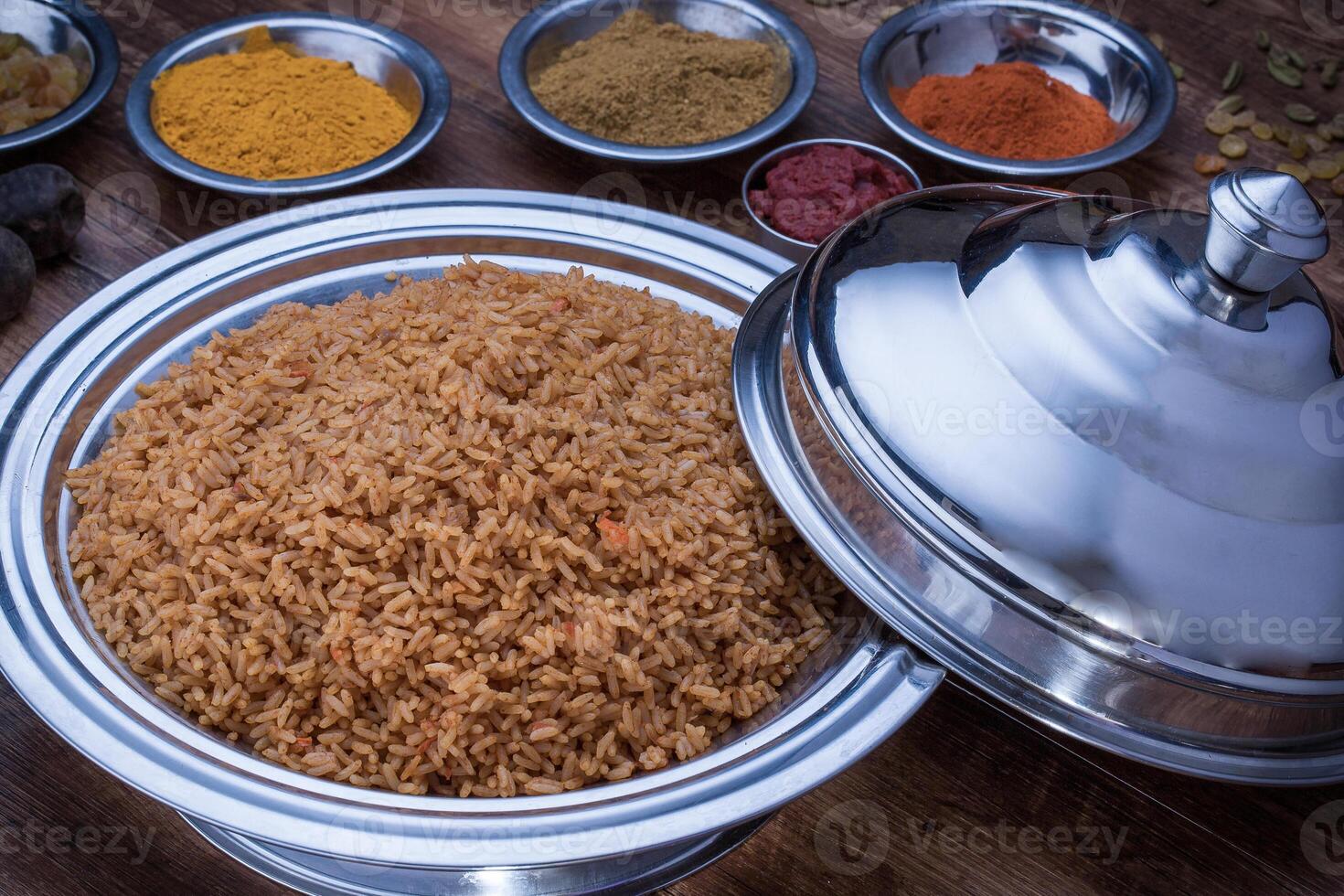Bashawer Rice, mandi, biryani with fried onion served in dish isolated on table top view of arabic food photo
