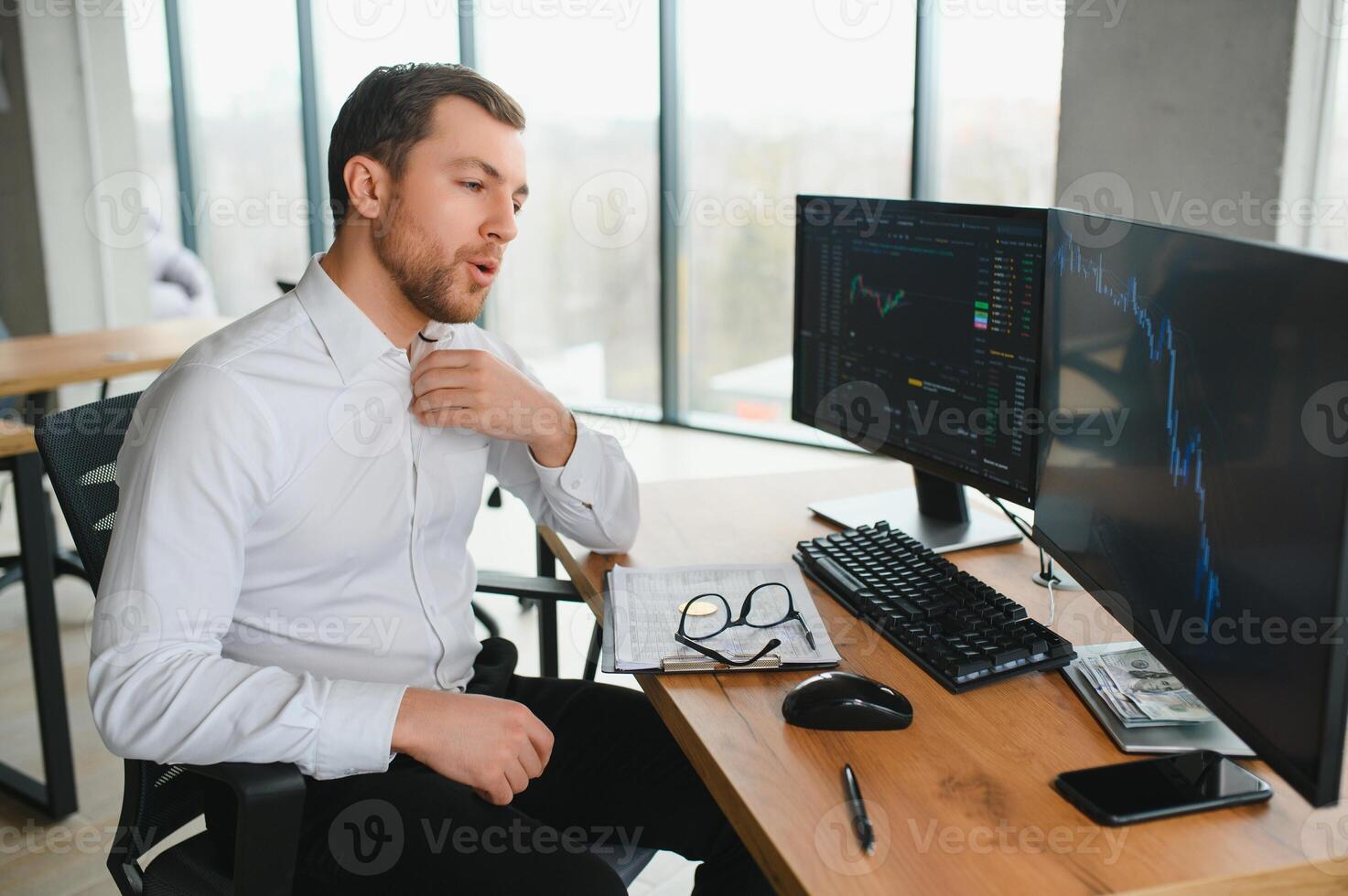 Serious business man trader analyst looking at computer monitor, investor broker analyzing indexes, financial chart trading online investment data on cryptocurrency stock market graph on pc screen. photo