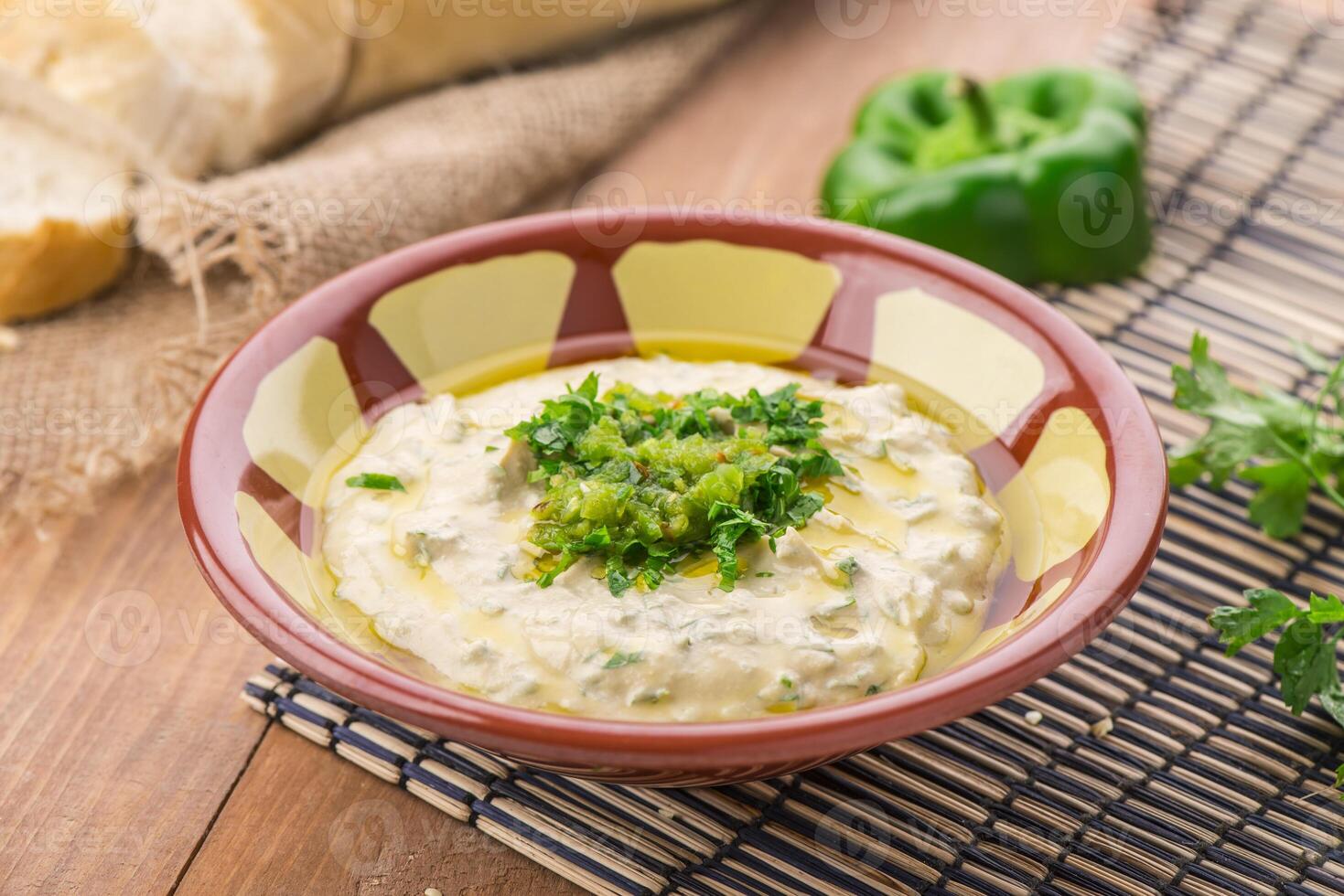 Beiruti hummus served in dish isolated on table side view of arabic food photo