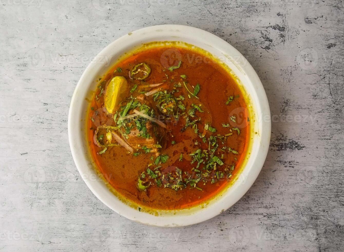 Spicy beef nihari served in a plate isolated on background top view of indian and pakistani desi food photo