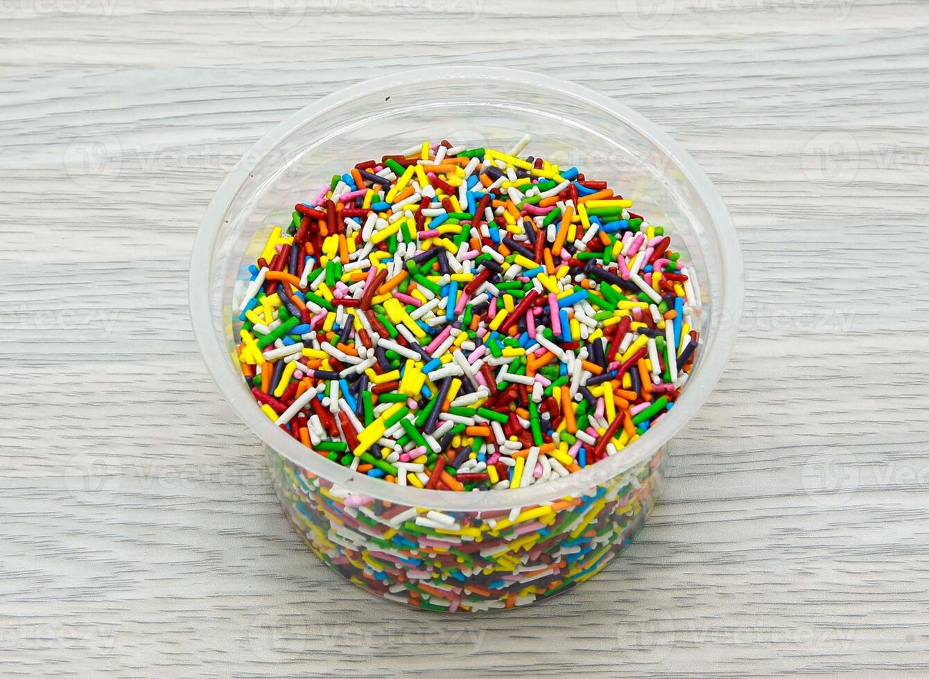 sprinkles bright colors served in disposable cup side view of indian and pakistani dessert photo