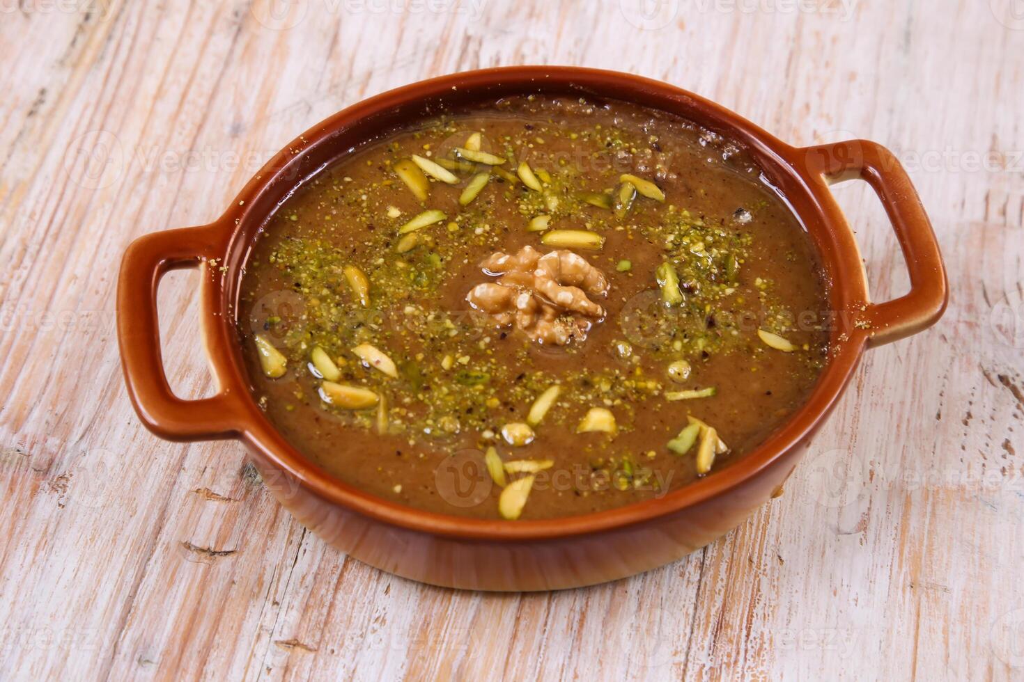 Arab Khabeesa halwa eid sweet served in dish isolated on table top view of arabic dessert photo