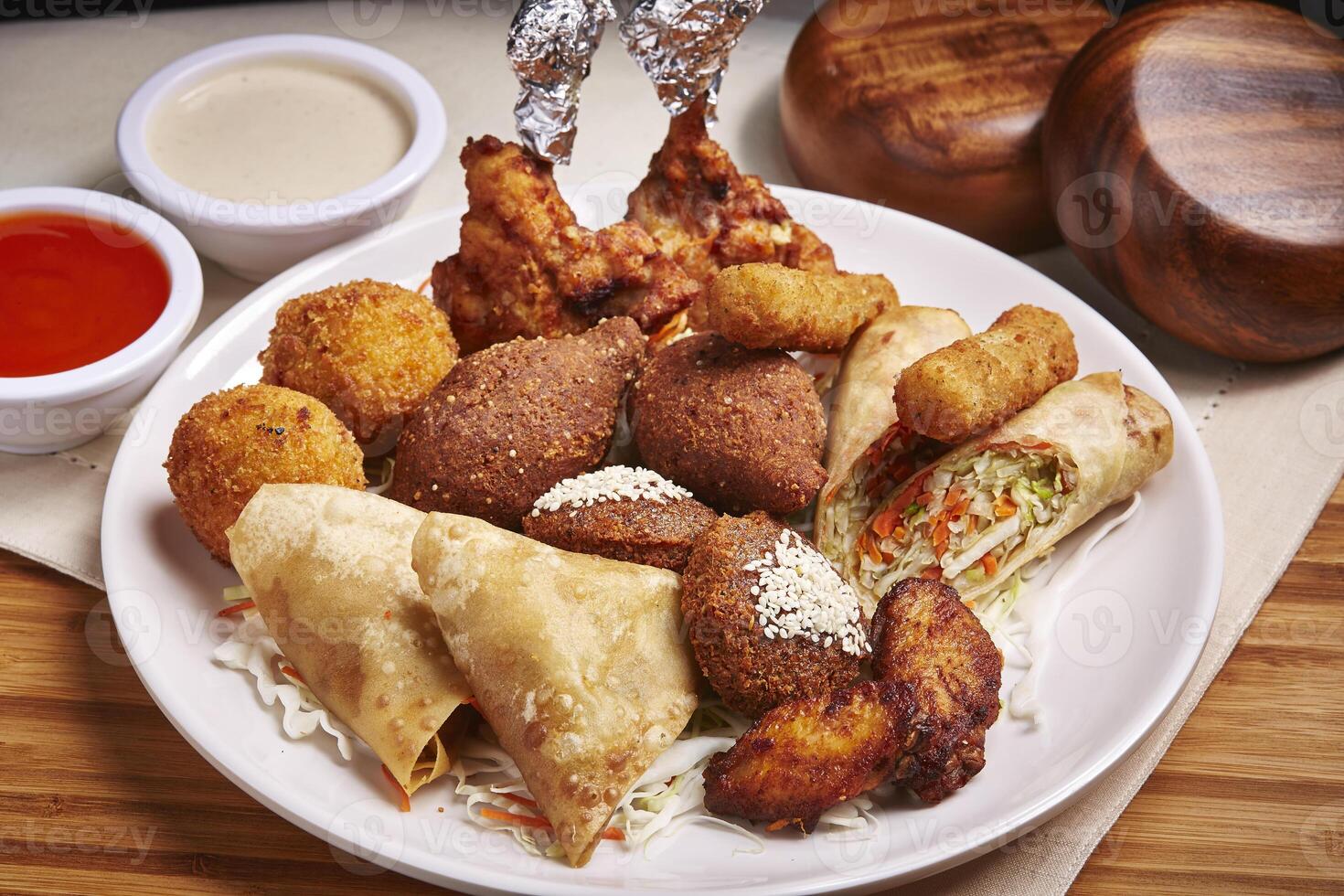 Marmaris Hot Mezze with dip served in dish isolated on table side view of middle east food photo