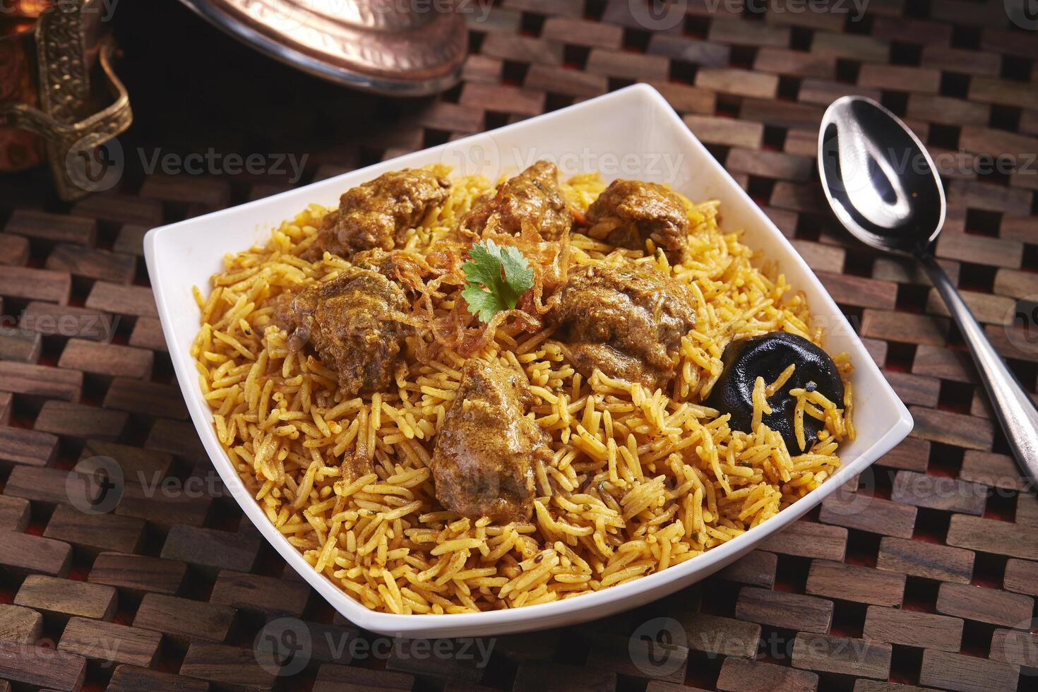 Hamour Machboos biryani served in dish isolated on table side view of middle east food photo