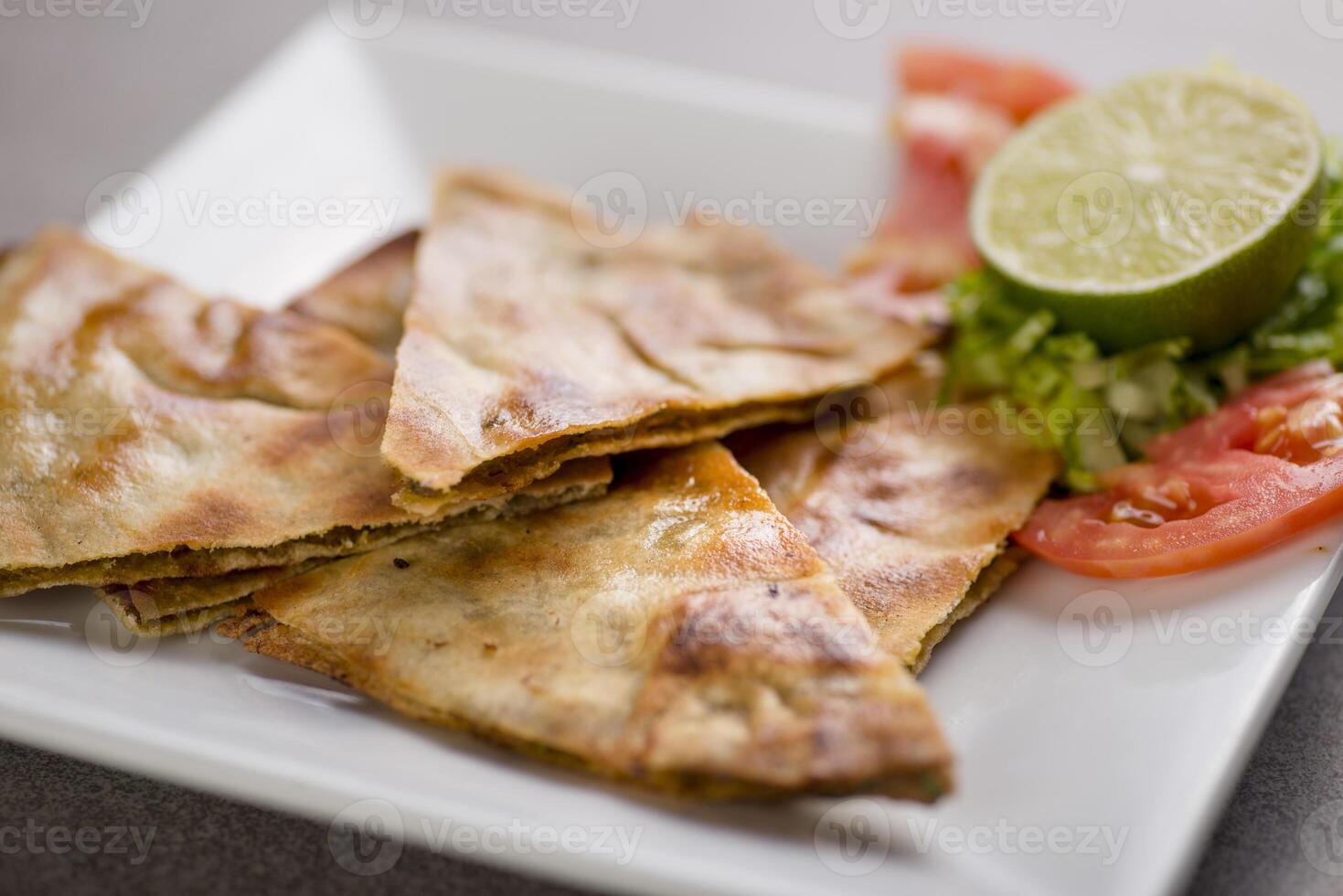 arais shawarma wrap snack with lime and salad served in dish isolated on grey background top view of arabic food photo