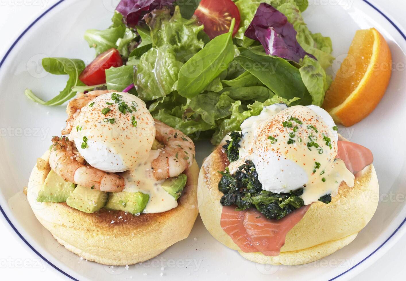 Kiseki Pancake Eggs Benedict with herbs and vegetable in white plate closeup photo