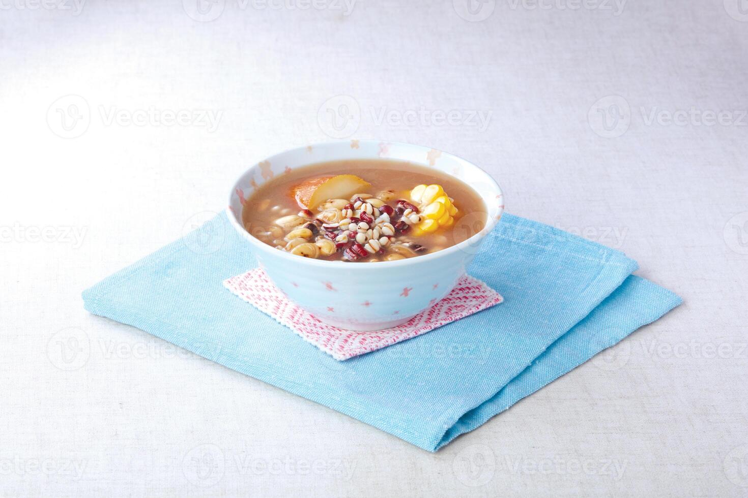 Chixiaodou and barley seed soup served in a bowl isolated on napkin side view of hong kong food photo