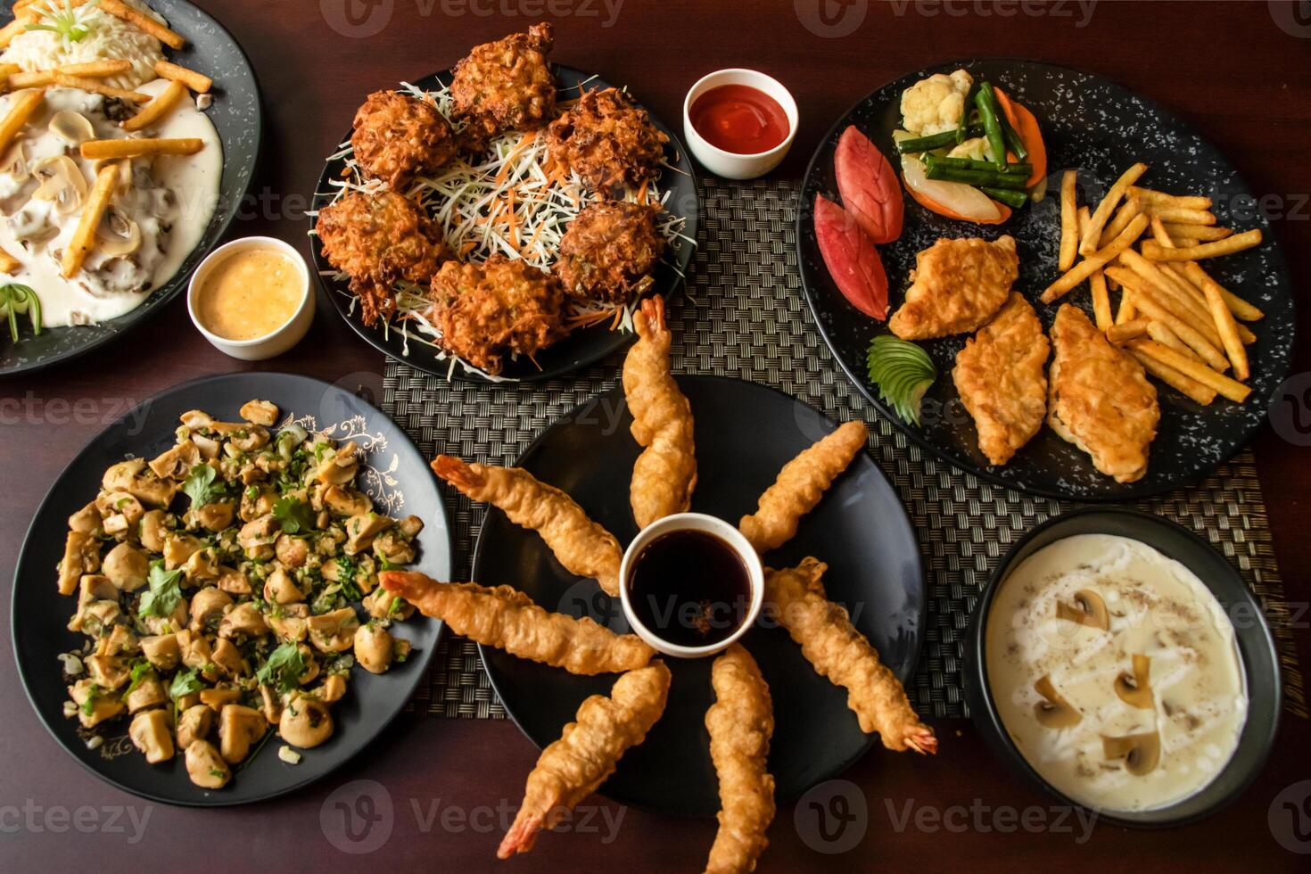 Garlic Mushroom, Vegetables Pakora, Prawn Tempura, Mushroom chicken piccata, Grilled Fish, swatted vegetables, chilli and soy sauce, mayo dip served top view of bangladesh and indian food photo