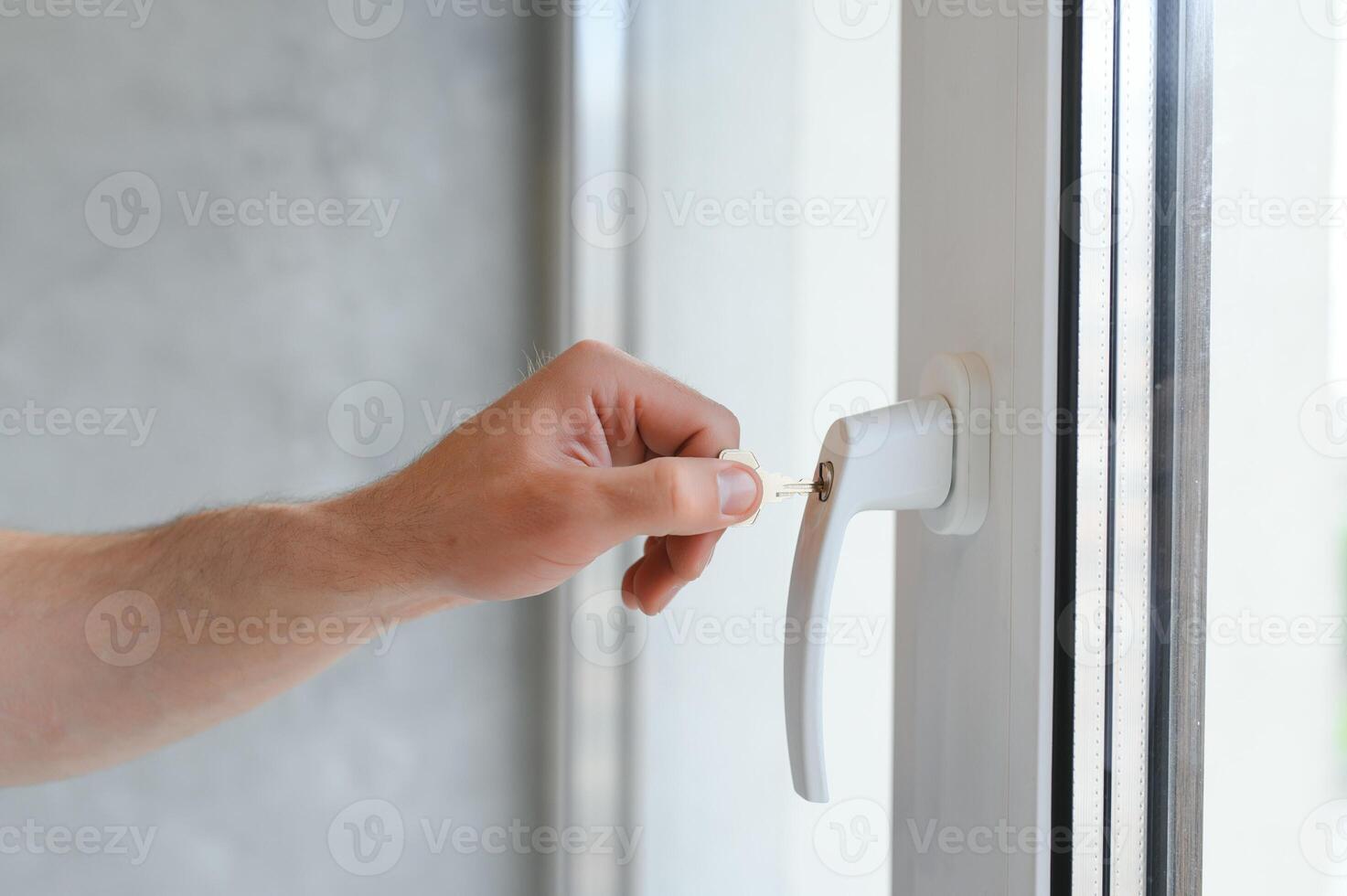 Window handle lock. Key locking window with key for kids safety. Window Restrictors in the home. photo