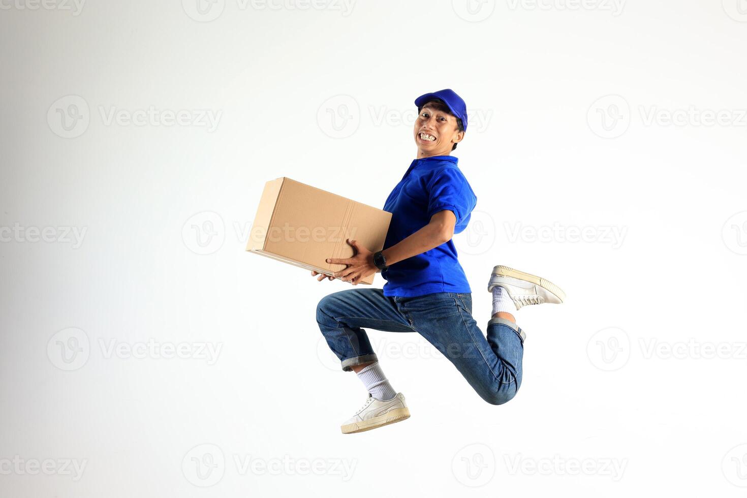 Male Delivery Courier Jumping with Cardboard Boax, Shipment Package Concept photo