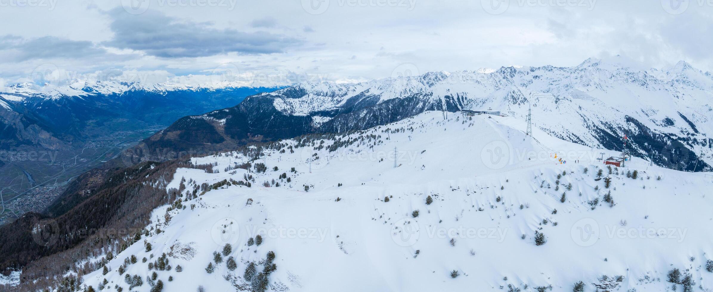 Winter Wonderland  Aerial View of Verbier, Switzerland Amid Snowy Peaks photo