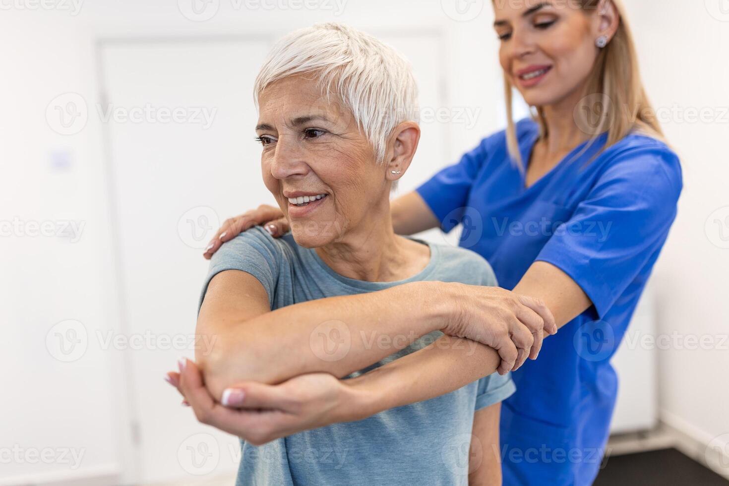 Professional therapists is stretching muscles, senior patient with abnormal muscular symptoms, physical rehabilitation therapies and treatment of physiological disorders by physiotherapists concept. photo