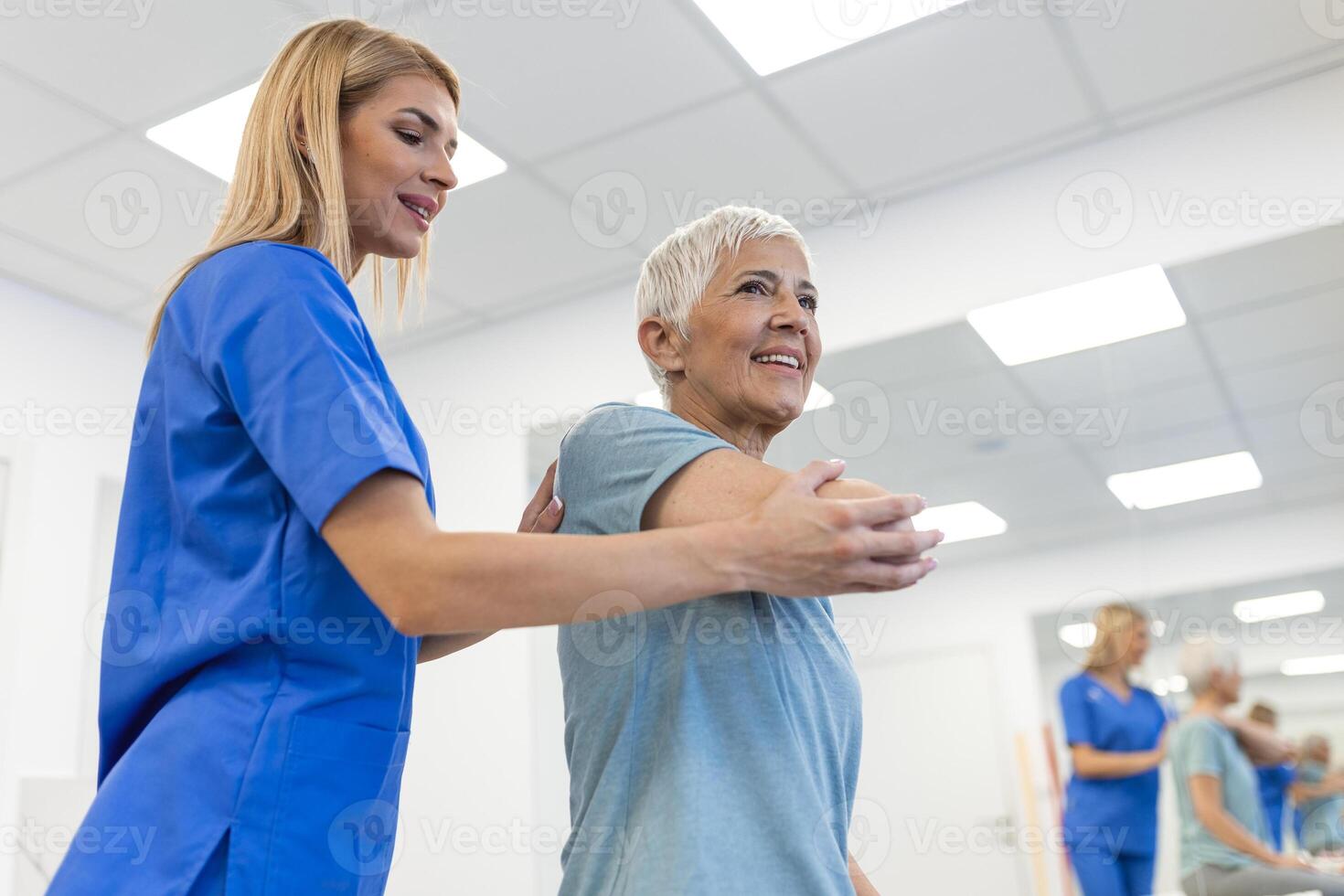Professional therapists is stretching muscles, senior patient with abnormal muscular symptoms, physical rehabilitation therapies and treatment of physiological disorders by physiotherapists concept. photo