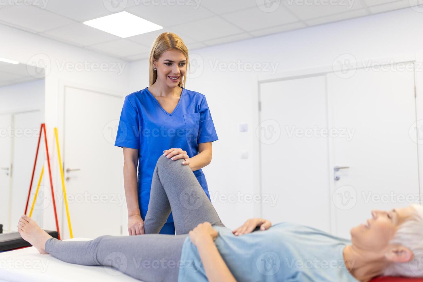 physiotherapist massaging and kneading a patient's leg provides medical care for sprained ligaments. Concept of rehabilitation and recovery after physical leg injuries. photo