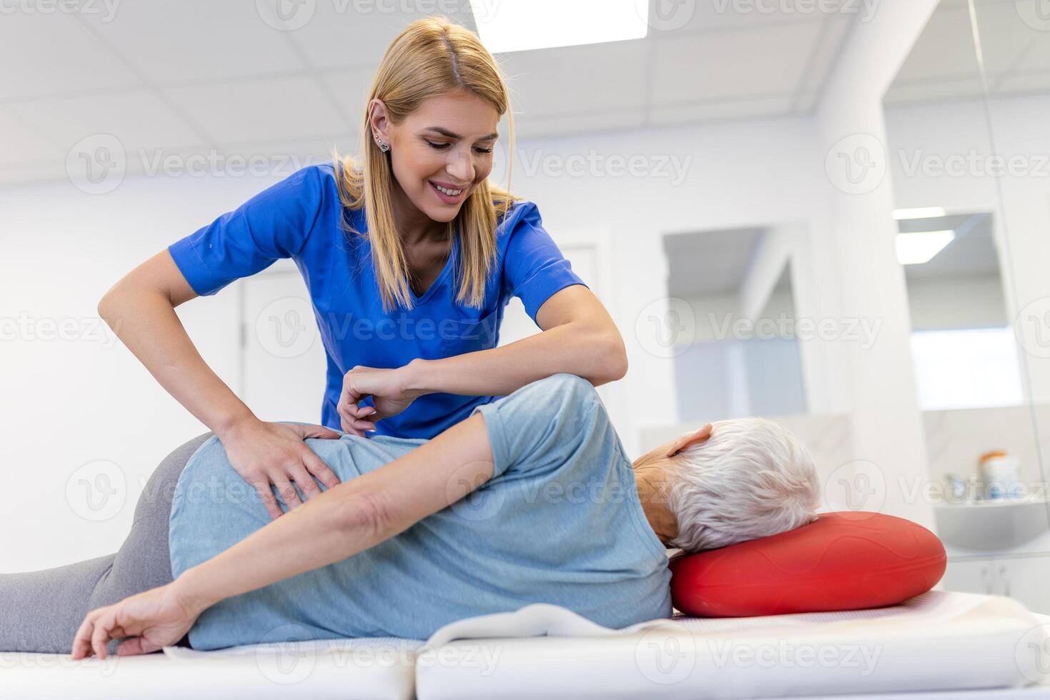 Senior woman having chiropractic back adjustment. Osteopathy, Alternative medicine, pain relief concept. Physiotherapy, injury rehabilitation photo