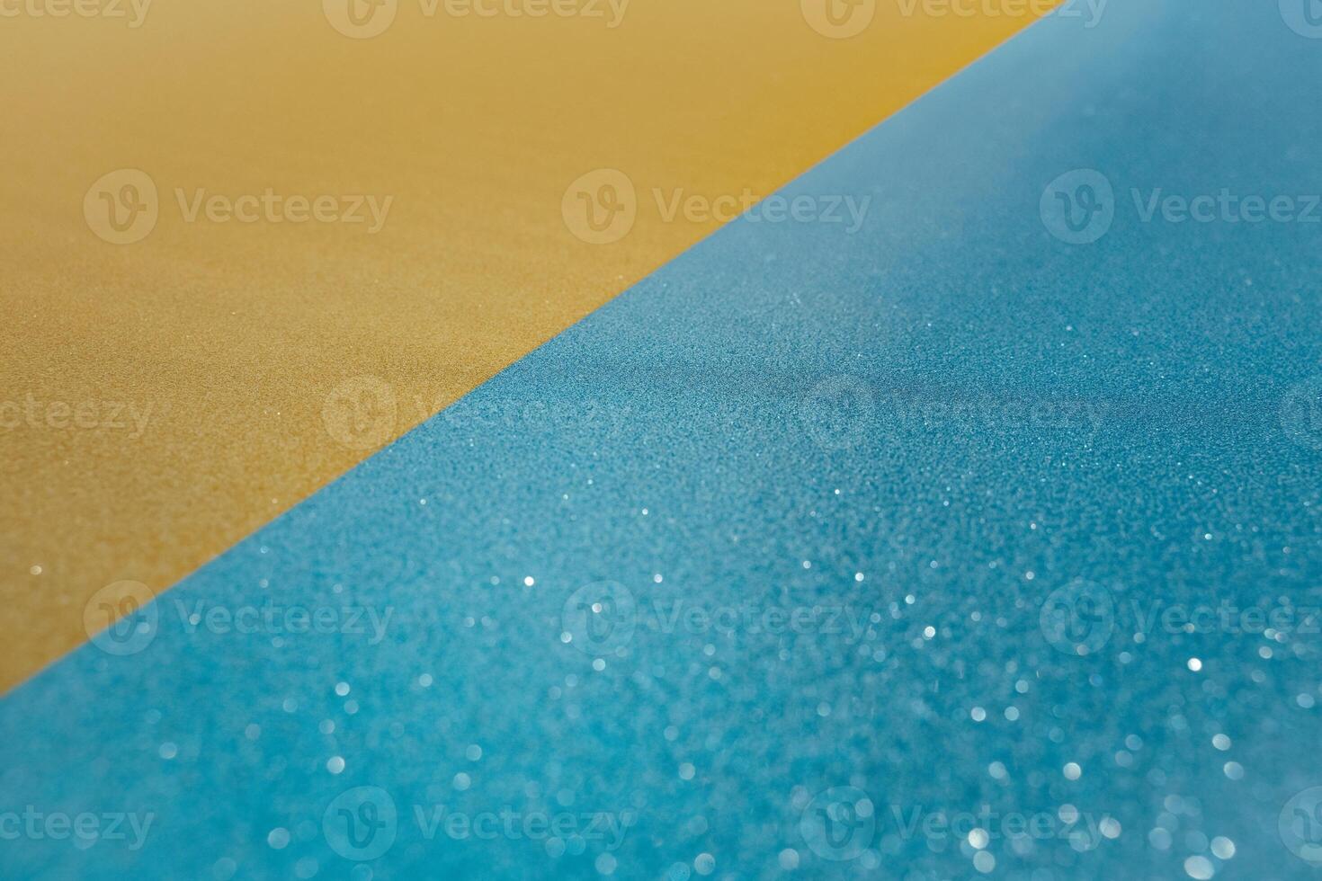 Abstract beach with glitter paper sand and water photo