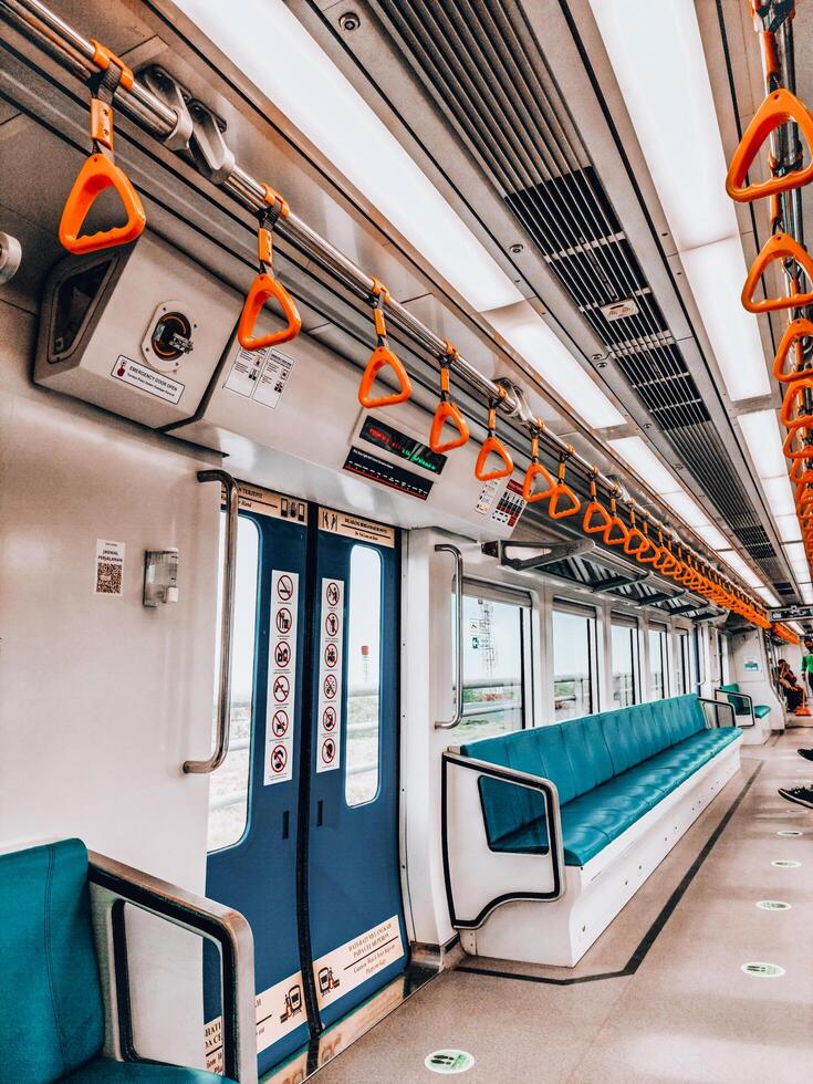 Palembang, Indonesia, June 16, 2022. Empty train waiting at the LRT station photo