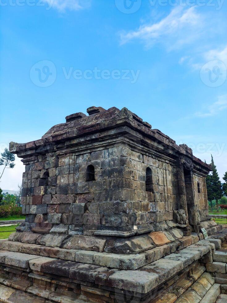 Dramatic and dynamic Sunrise at Arjuna Temple of Dieng-Central Java photo