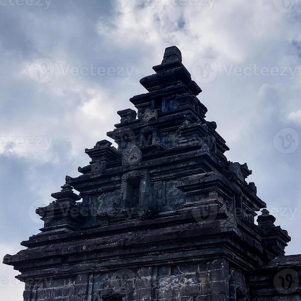 Dramatic and dynamic Sunrise at Arjuna Temple of Dieng-Central Java photo