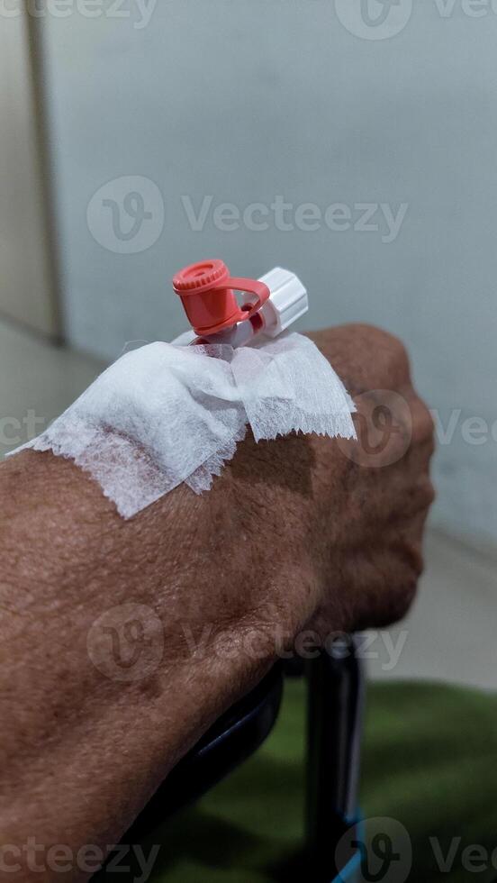 Close-up of a bandage on a person's arm after blood draw photo