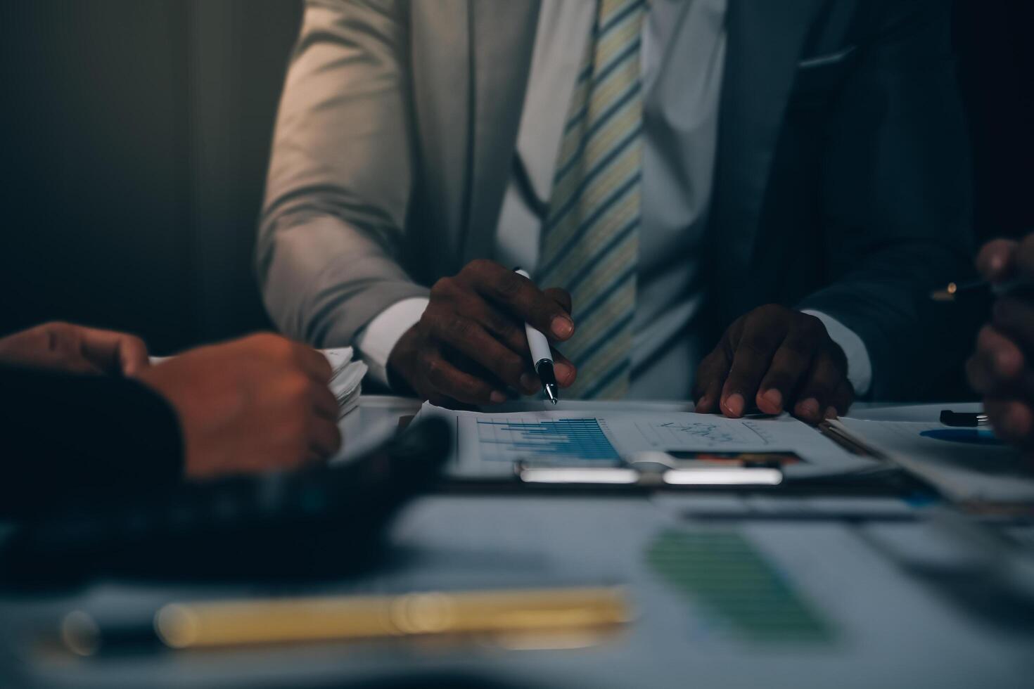 Business team meeting present, investor colleagues consultation and conference new strategy plan business and market growth on financial document graph report, Meeting and Talking. photo