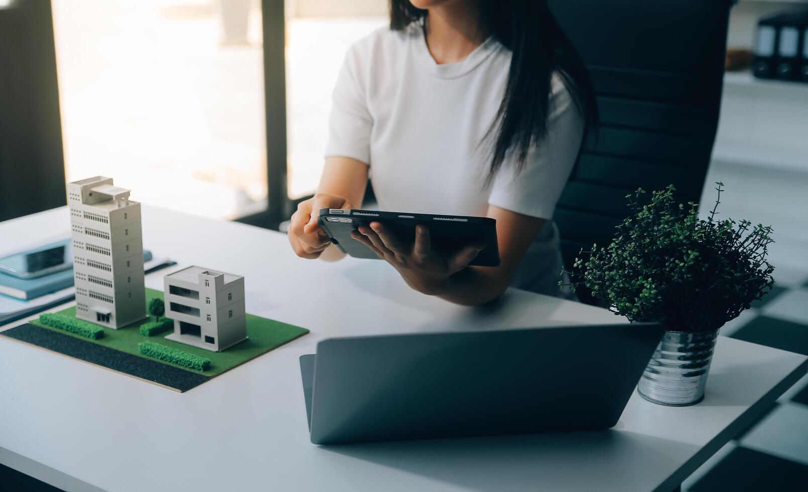 Real estate broker agent presenting and consult to customer to decision making sign insurance form agreement, buy and sell home model, concerning mortgage loan offer for and house insurance photo