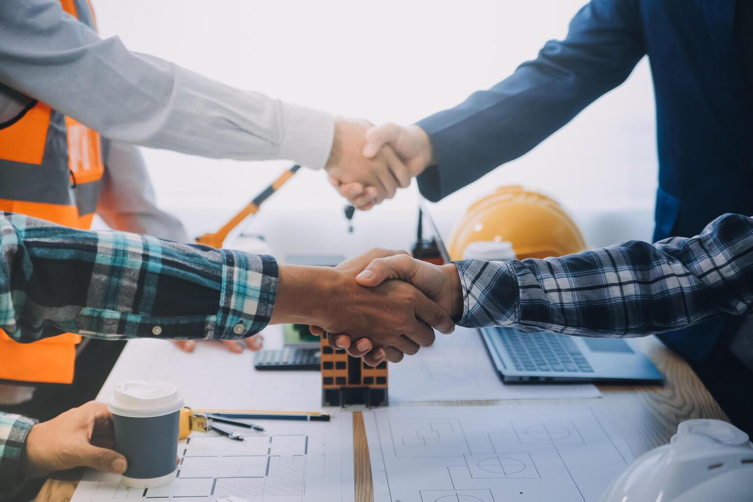 Image of engineer meeting for architectural project. working with partner and engineering tools on workplace vintage tone. photo