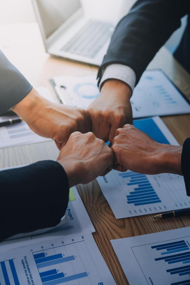 Business people join hands to join forces as a teamwork. photo