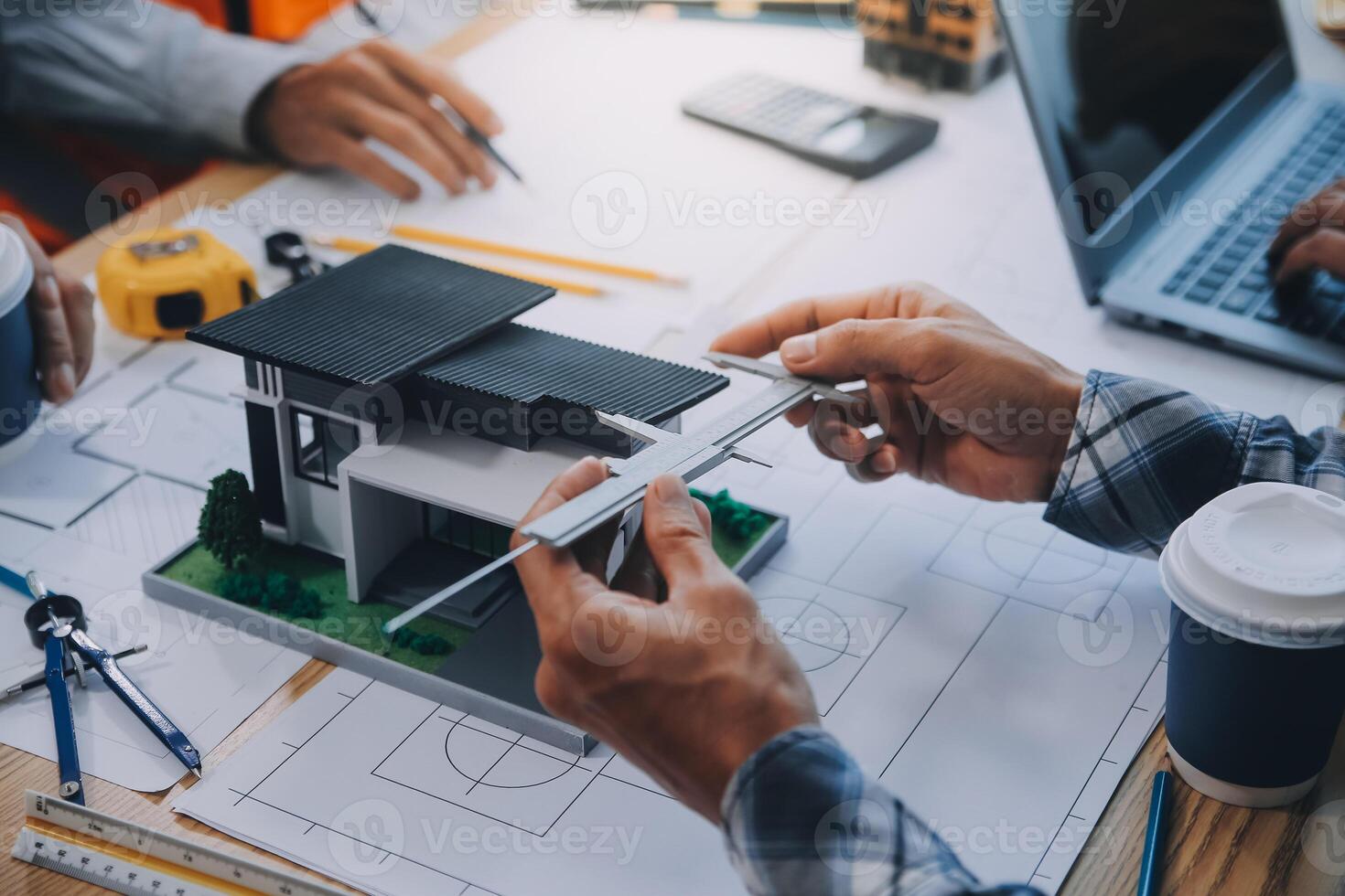 Image of engineer meeting for architectural project. working with partner and engineering tools on workplace vintage tone. photo