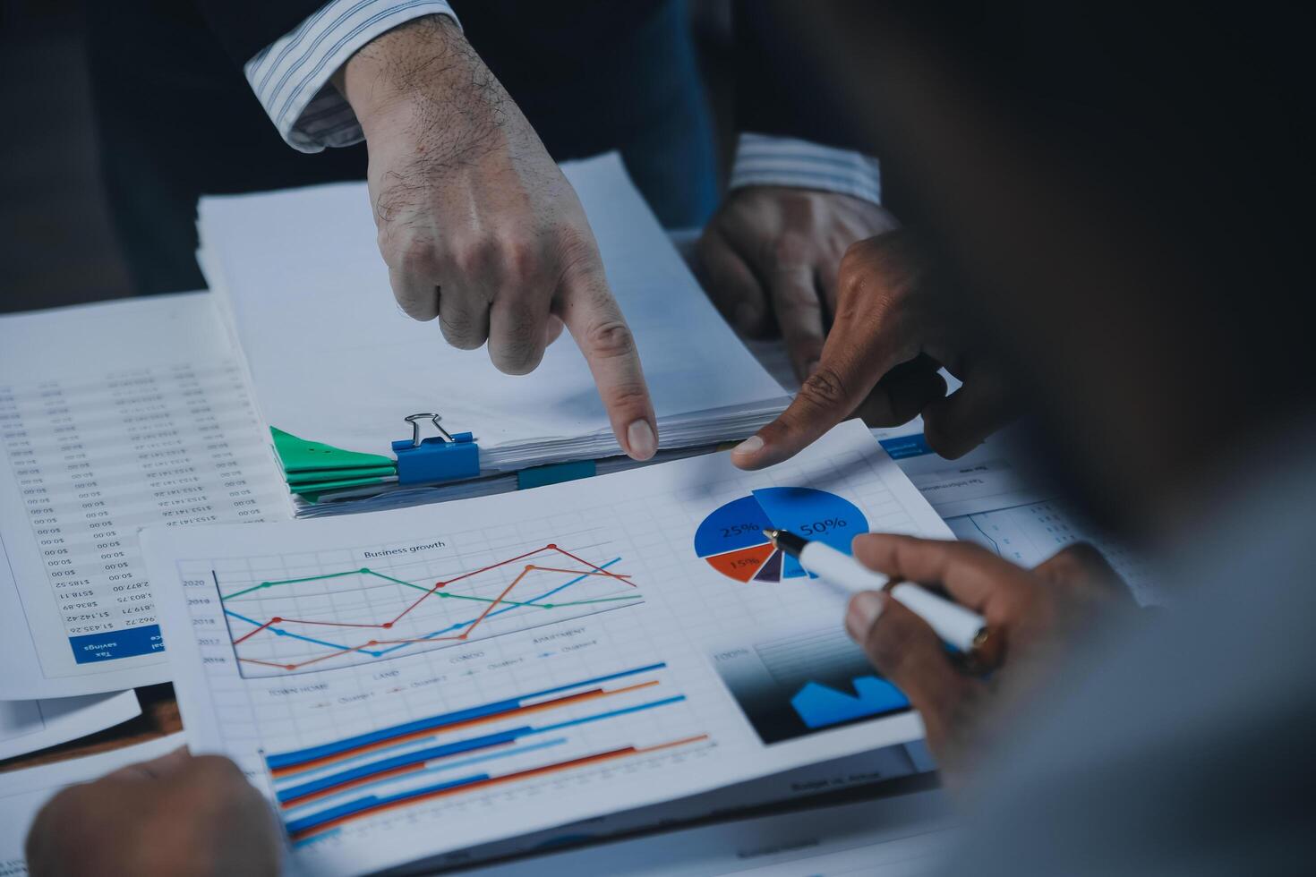 Business idea. Business people talking And calculations about charts and graphs showing the growth of investment results Of successful teamwork photo