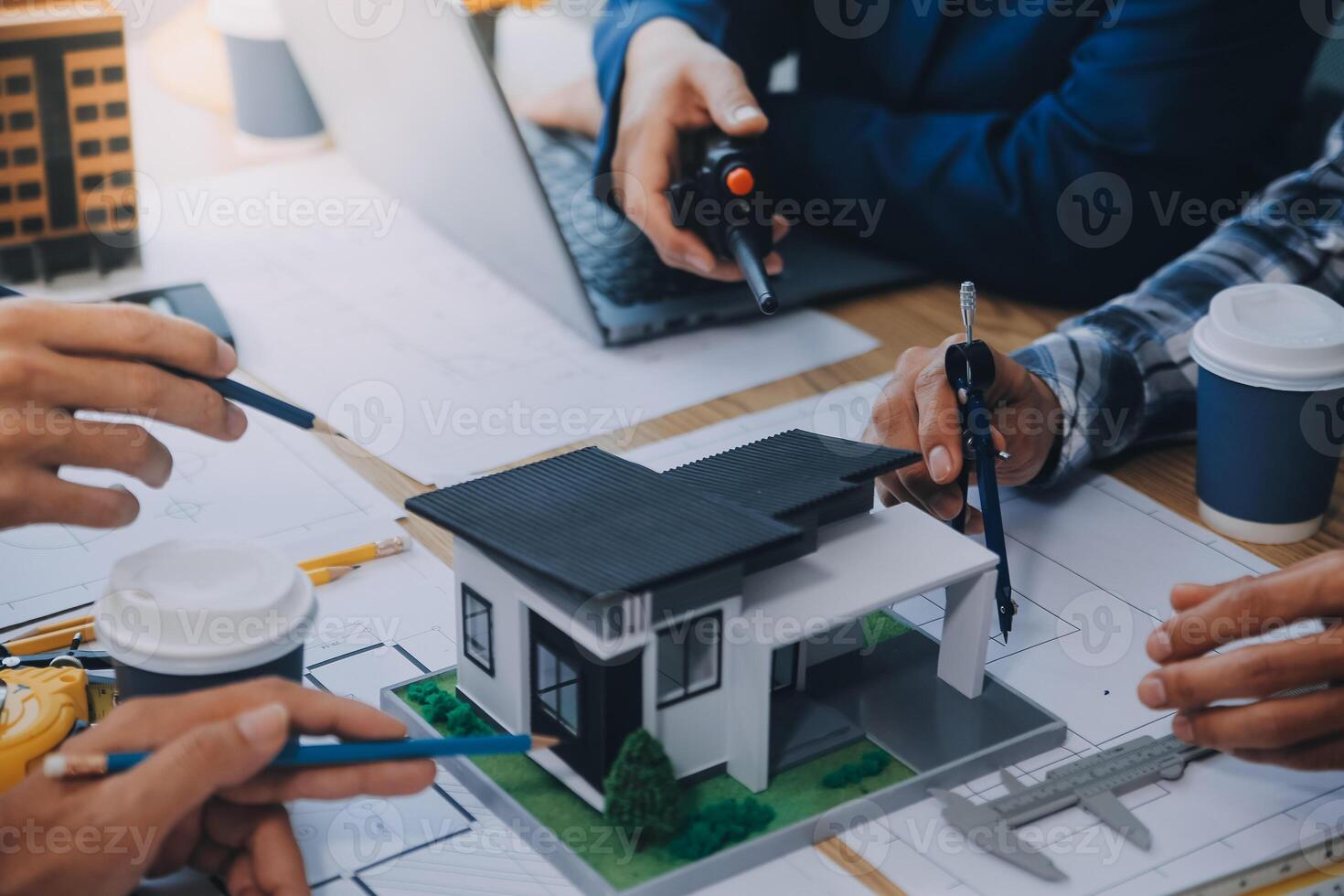 Image of engineer meeting for architectural project. working with partner and engineering tools on workplace vintage tone. photo