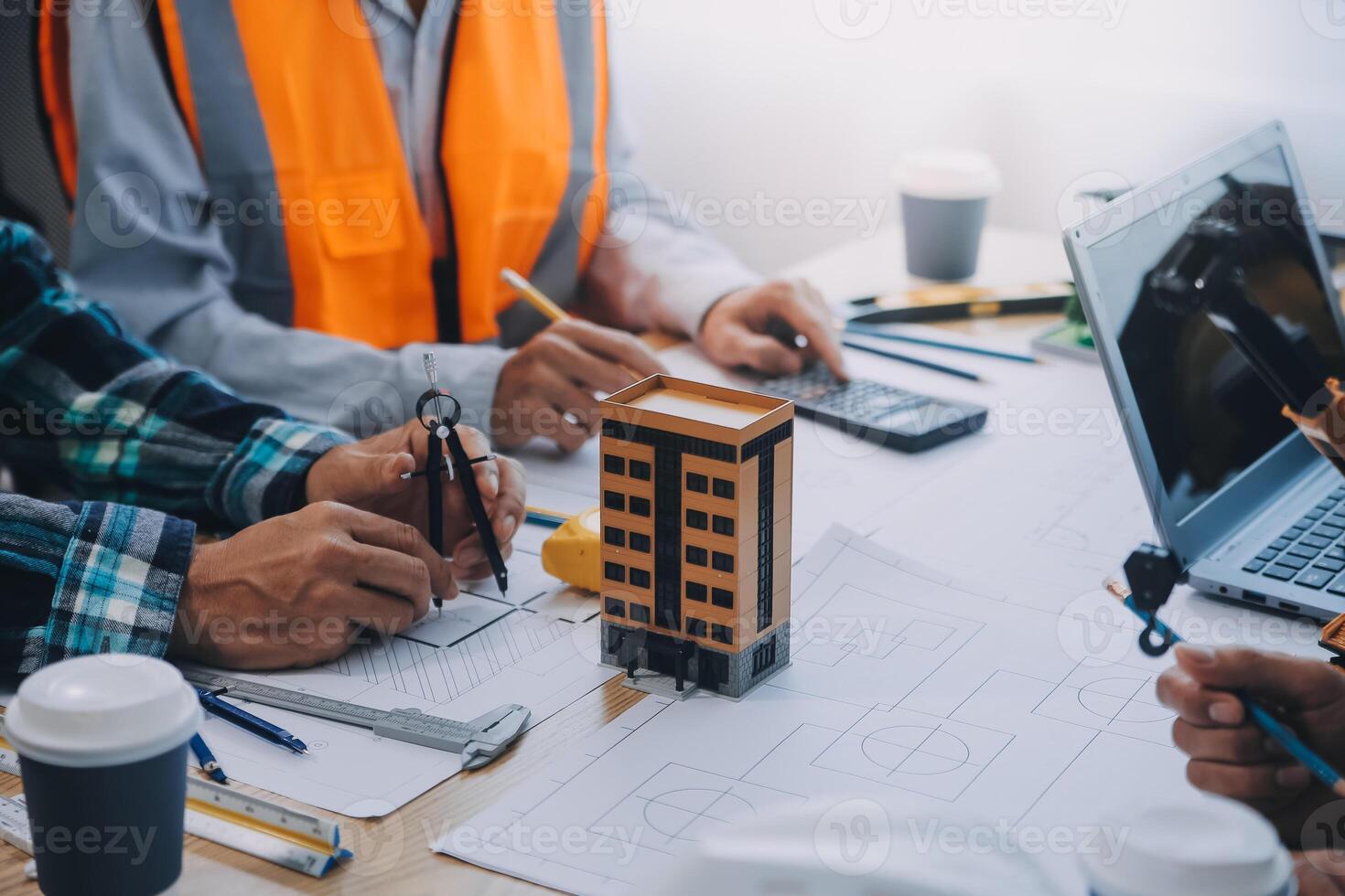 Image of engineer meeting for architectural project. working with partner and engineering tools on workplace vintage tone. photo