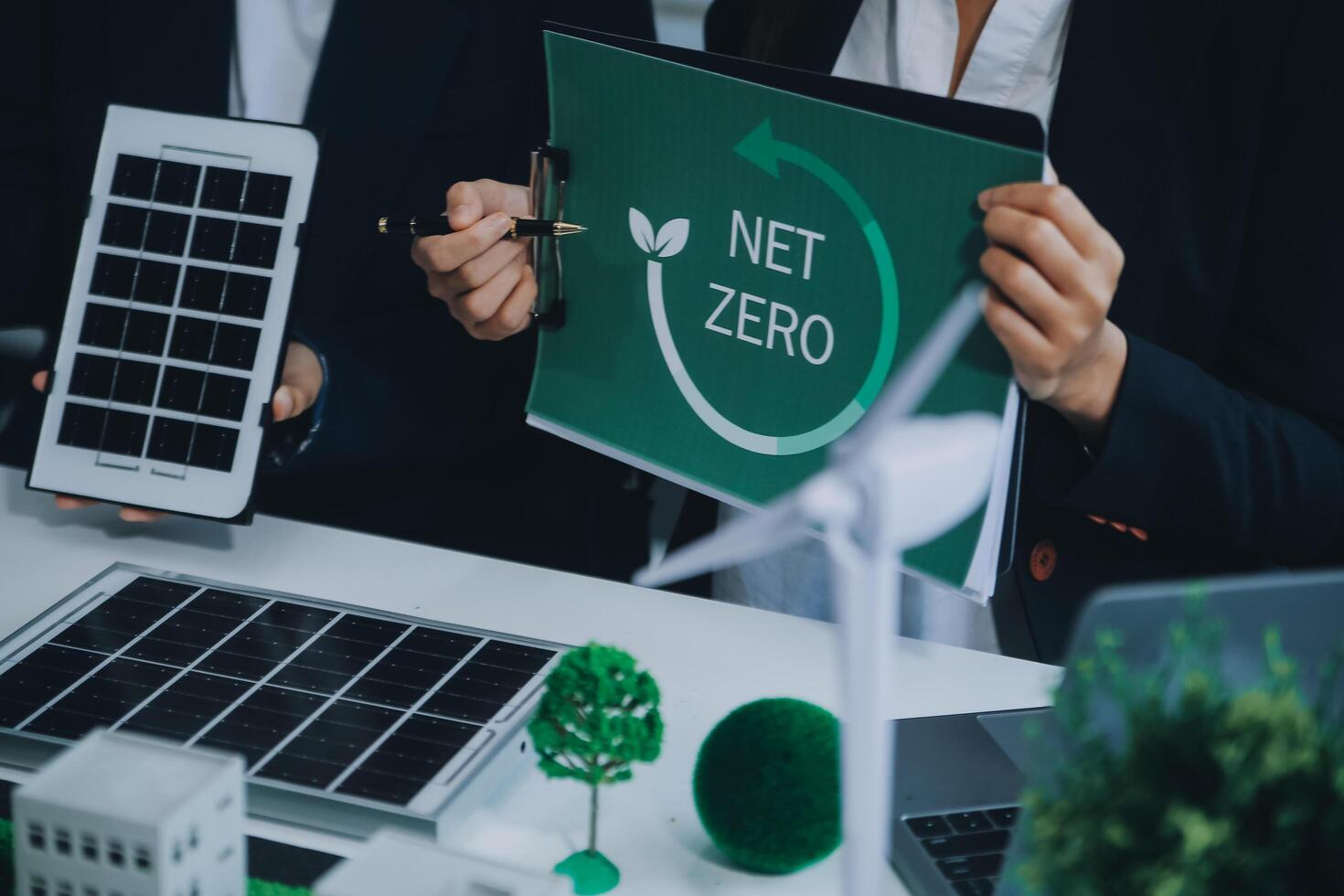 Carbon offset price report CO2 emission. Future growth Net zero waste in ESG ethical SME office protect climate change global warming social issues project. Group of asia people Eco friendly SDGs plan photo