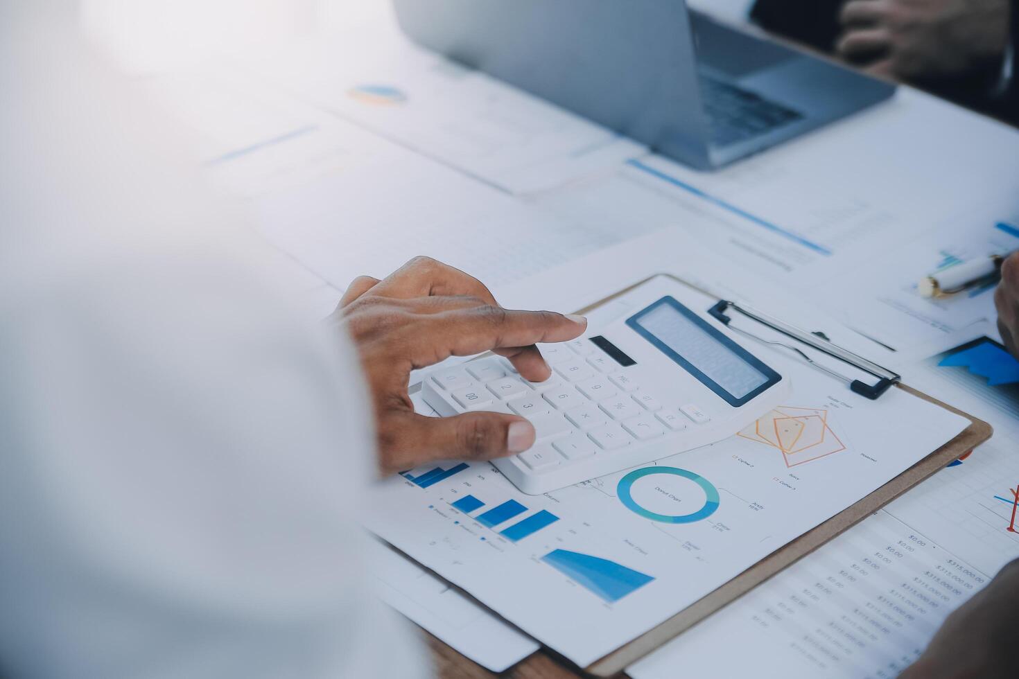 Business team collaboration discussing working analyzing with financial data and marketing growth report graph in team, presentation and brainstorming to strategy planning making profit of company. photo