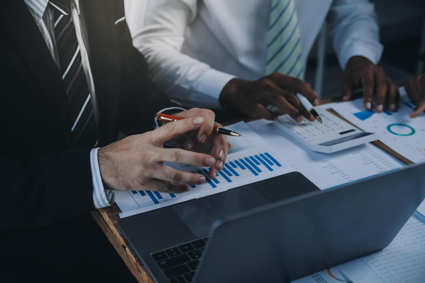 Business team collaboration discussing working analyzing with financial data and marketing growth report graph in team, presentation and brainstorming to strategy planning making profit of company. photo