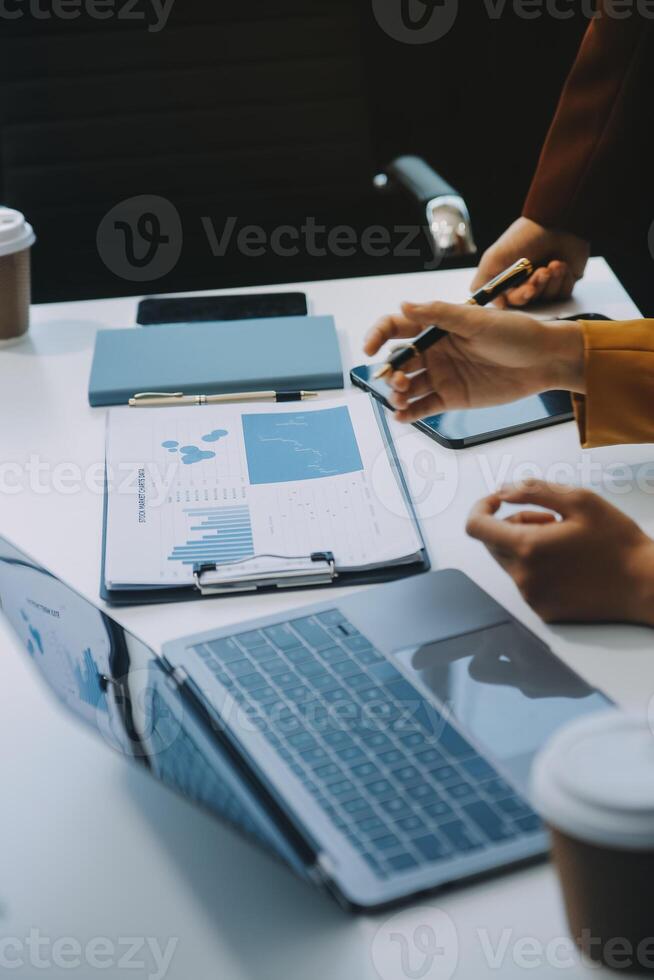 Financial Business team present. Business man hands hold documents with financial statistic stock photo, discussion, and analysis report data the charts and graphs. Finance Financial concept photo