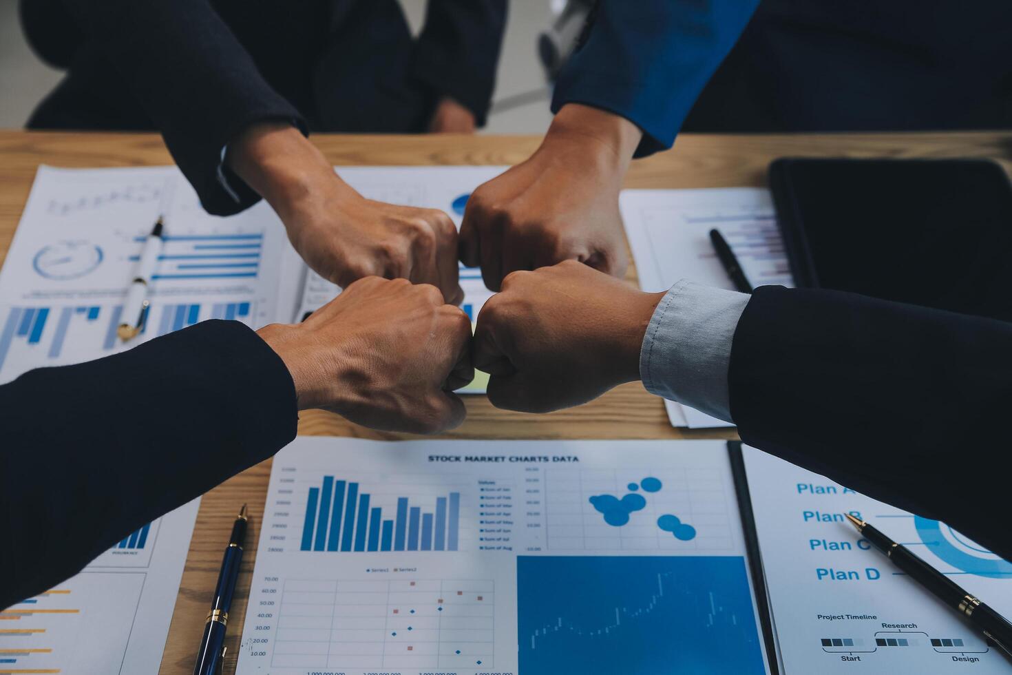 Business people join hands to join forces as a teamwork. photo