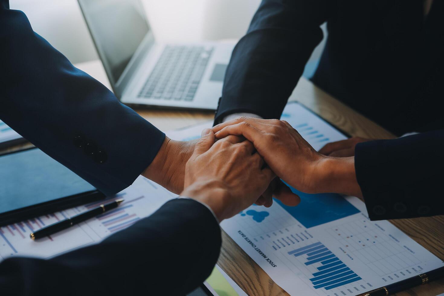 Business people join hands to join forces as a teamwork. photo