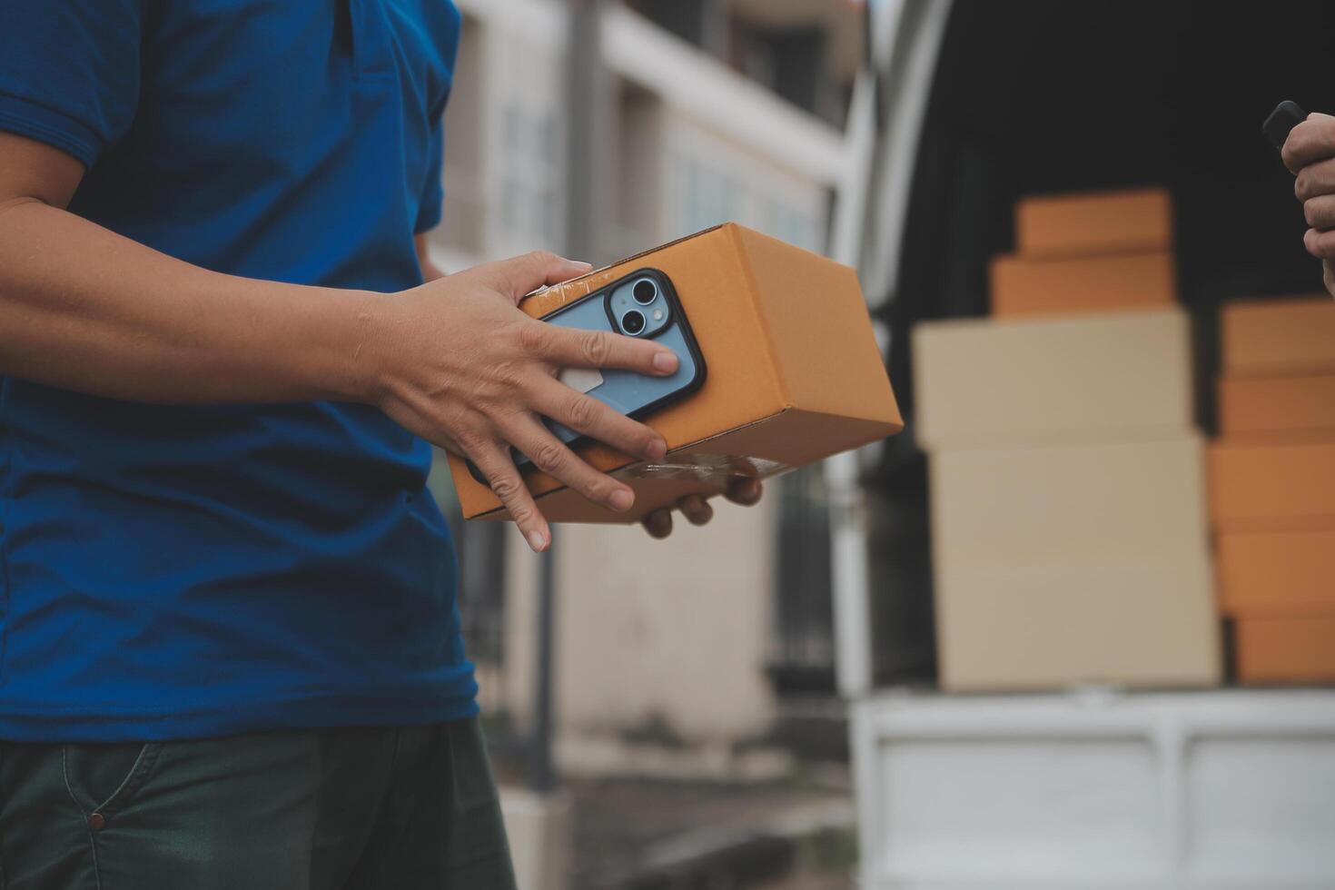 Asian delivery express courier young man use giving boxes to woman customer he wearing protective face mask at front home photo