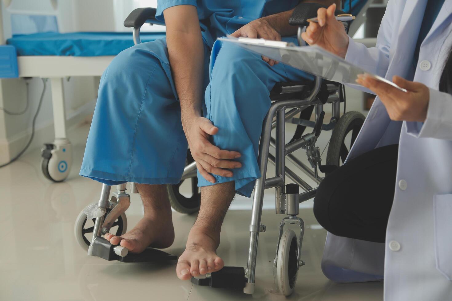 young asian physical therapist working with senior woman on walking with a walker photo